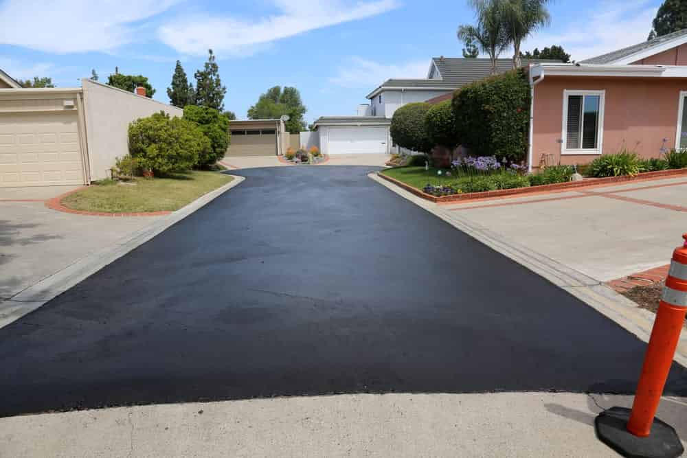 Private drive way, street rehabilitation and slurry seal project finished with crews expertly applying the slurry seal.
